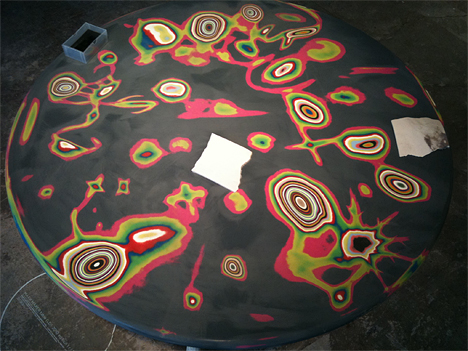 Color-layered table decorated by sanding